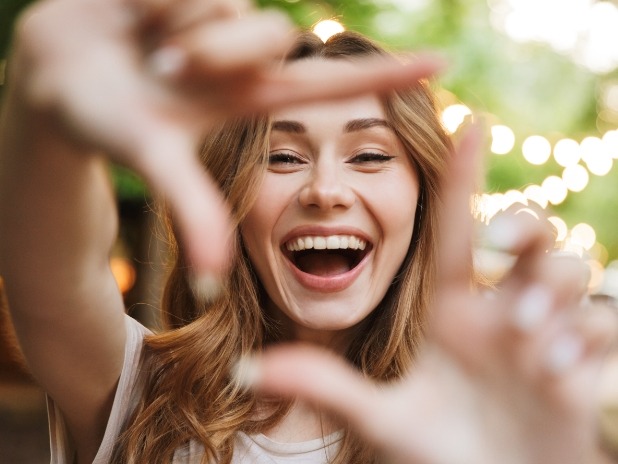 Woman showing off smile after cosmetic dentistry