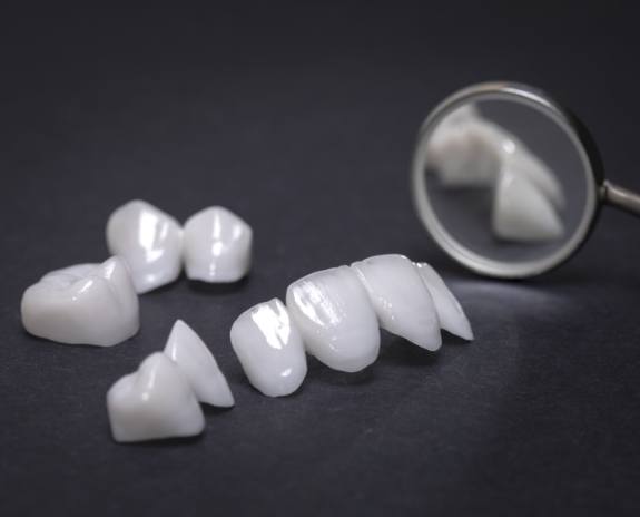 Metal free dental crowns and other restorations prior to placement