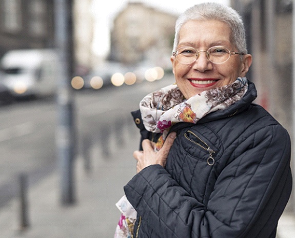 Woman smiling with dentures in Florence