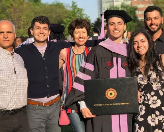 Doctor Montalbano and his family at school graduation