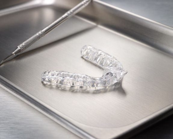 Clear nightguard for bruxism on metal tray