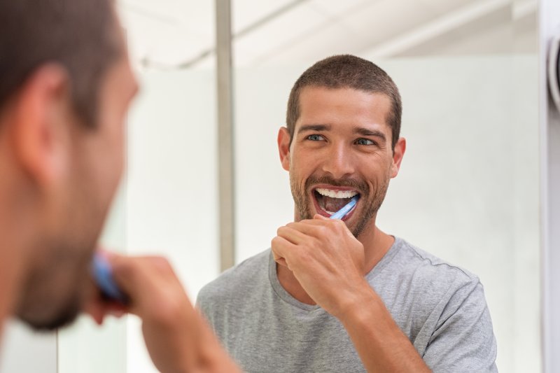 man practicing teeth cleaning in Florence